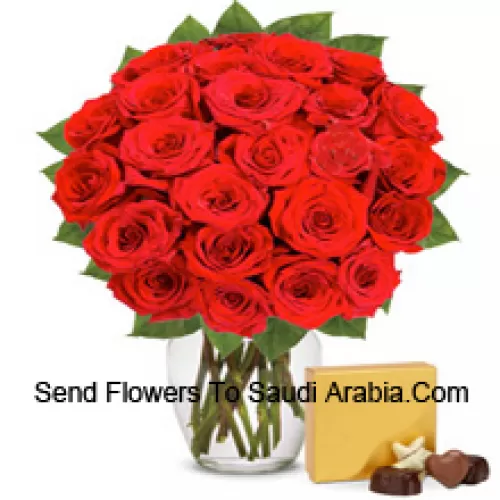 30 Red Roses With Some Ferns In A Glass Vase Accompanied With An Imported Box Of Chocolates
