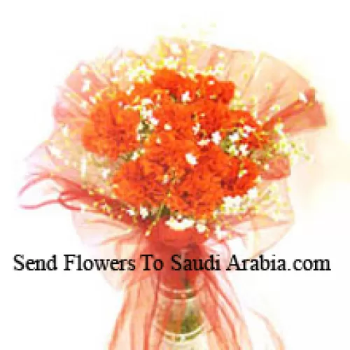 12 Orange Carnations With Some Ferns In A Vase