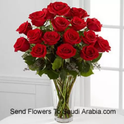 18 Red Roses With Some Ferns In A Vase